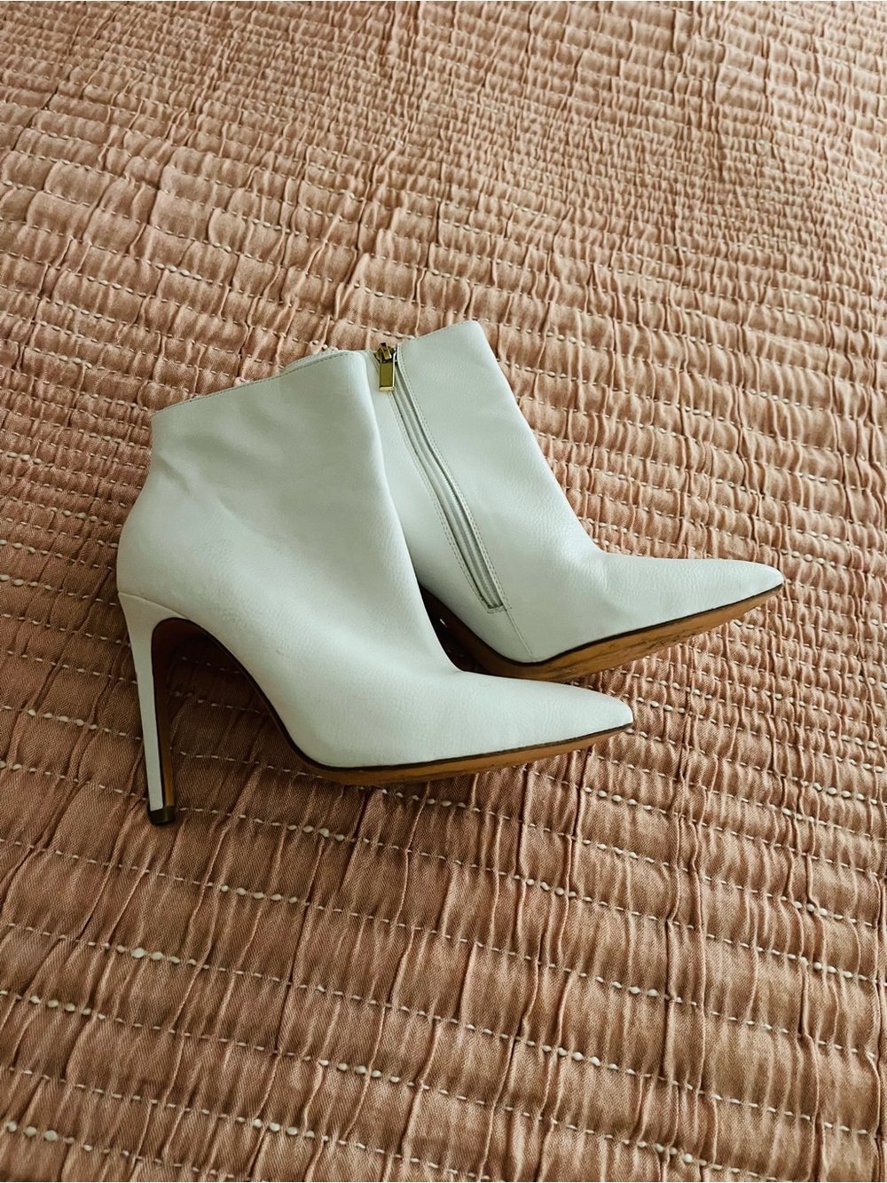 White stiletto ankle booties by Raye.